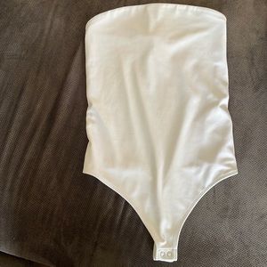 Express solid white strapless top size XS. Never worn without tag.